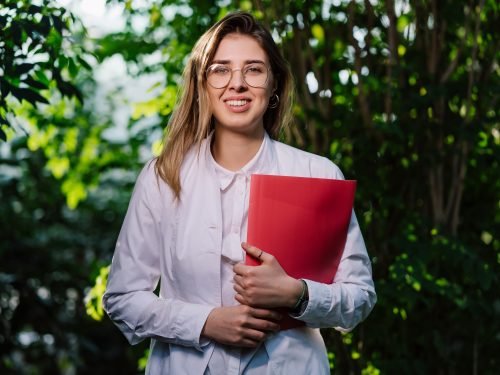 Young Female Scientist In Greenhouse Researching Plants